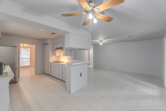 3906 Antoine Dr, Houston, TX 77092 - kitchen with freestanding refrigerator, a ceiling fan, light countertops, and open floor plan