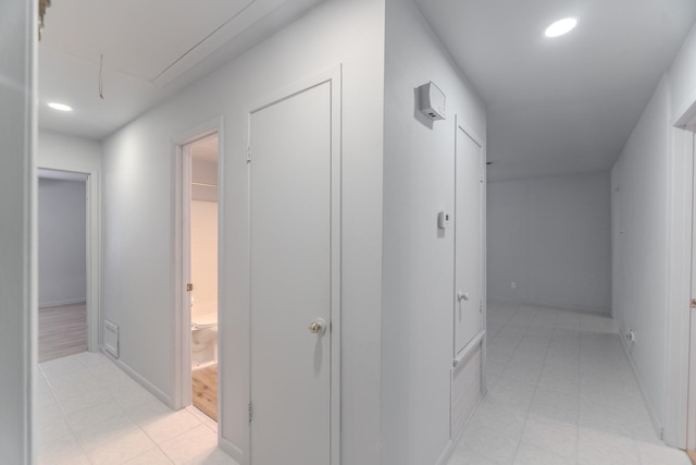 3906 Antoine Dr, Houston, TX 77092 - hall with recessed lighting, attic access, and light tile patterned floors