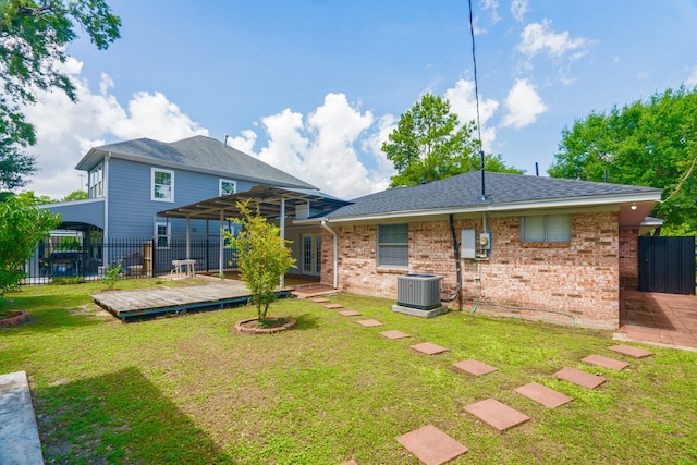 3906 Antoine Dr, Houston, TX 77092 - back of property featuring a wooden deck, brick siding, and roof with shingles