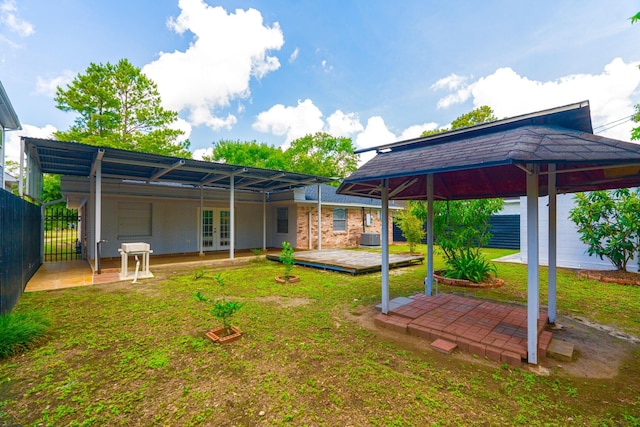 3906 Antoine Dr, Houston, TX 77092 - rear view of house featuring french doors, a deck, a patio area, a gazebo, and brick siding