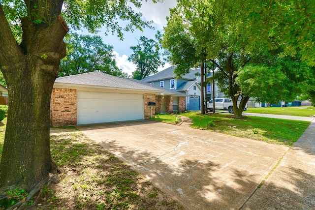 3906 Antoine Dr, Houston, TX 77092 - view of front facade with brick siding, driveway, an attached garage, and a front yard