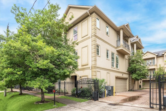 1316 Birdsall St, Houston, TX 77007 - view of building exterior featuring a garage and decorative driveway