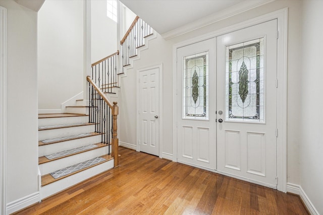 1316 Birdsall St, Houston, TX 77007 - foyer entrance featuring wood finished floors, healthy amount of natural light, and stairway