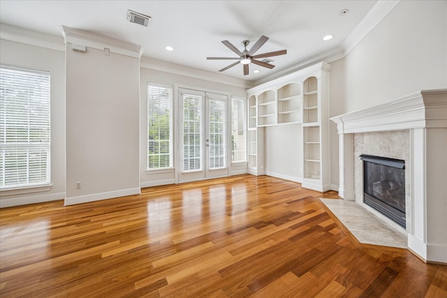 1316 Birdsall St, Houston, TX 77007 - unfurnished living room featuring a ceiling fan, wood finished floors, a high end fireplace, crown molding, and recessed lighting