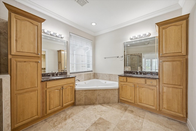 1316 Birdsall St, Houston, TX 77007 - full bathroom with a shower stall, two vanities, a garden tub, ornamental molding, and tile patterned floors