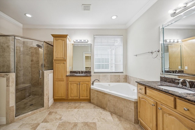 1316 Birdsall St, Houston, TX 77007 - full bathroom with a bath, two vanities, a stall shower, and crown molding