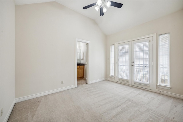 1316 Birdsall St, Houston, TX 77007 - empty room featuring lofted ceiling, french doors, ceiling fan, and light carpet