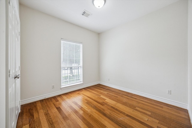 1316 Birdsall St, Houston, TX 77007 - unfurnished room with wood finished floors and baseboards
