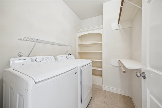 1316 Birdsall St, Houston, TX 77007 - laundry area featuring washer and clothes dryer and light tile patterned floors