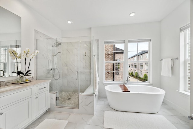 6114 Cottage Grove Lake Dr, Houston, TX 77007 - full bath with vanity, a freestanding bath, a marble finish shower, marble finish flooring, and recessed lighting