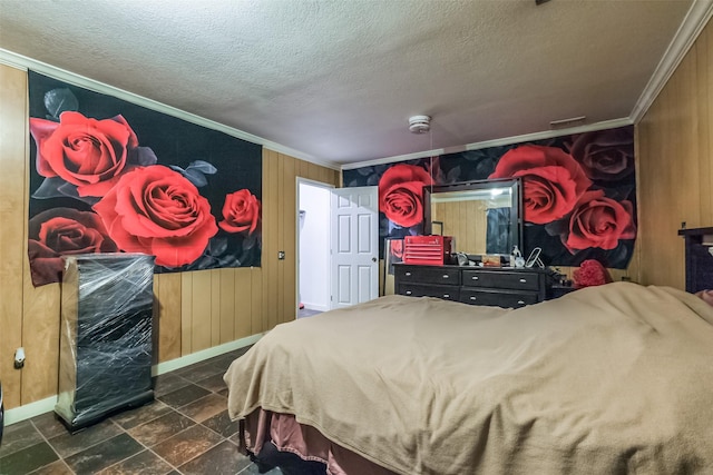 7528 Gainesville St, Houston, TX 77020 - bedroom featuring ornamental molding, a textured ceiling, dark stone finish flooring, and wood walls