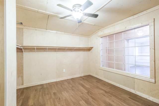 7528 Gainesville St, Houston, TX 77020 - empty room with wood finished floors, vaulted ceiling, and ceiling fan