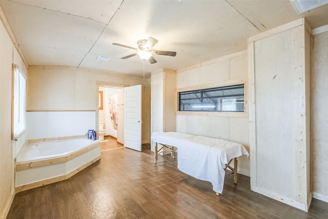 7528 Gainesville St, Houston, TX 77020 - bedroom featuring wood finished floors, ensuite bathroom, and a ceiling fan