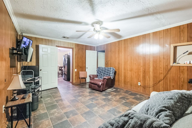 7528 Gainesville St, Houston, TX 77020 - sitting room with ceiling fan, wooden walls, and ornamental molding