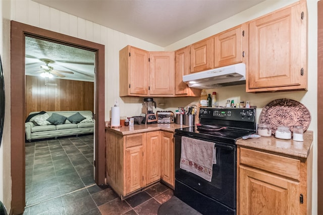 7528 Gainesville St, Houston, TX 77020 - kitchen featuring electric range, under cabinet range hood, wooden walls, a ceiling fan, and light brown cabinetry