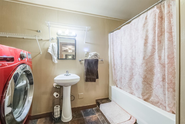 7528 Gainesville St, Houston, TX 77020 - bathroom featuring washer / clothes dryer, shower / bath combo with shower curtain, and stone finish flooring