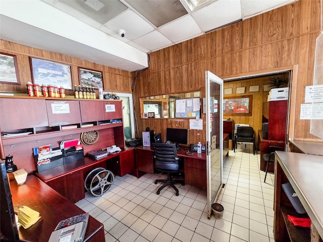 7528 Gainesville St, Houston, TX 77020 - office featuring wooden walls, tile patterned flooring, and a paneled ceiling