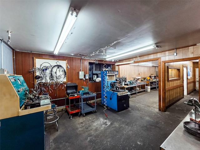 7528 Gainesville St, Houston, TX 77020 - garage with wood walls and a workshop area