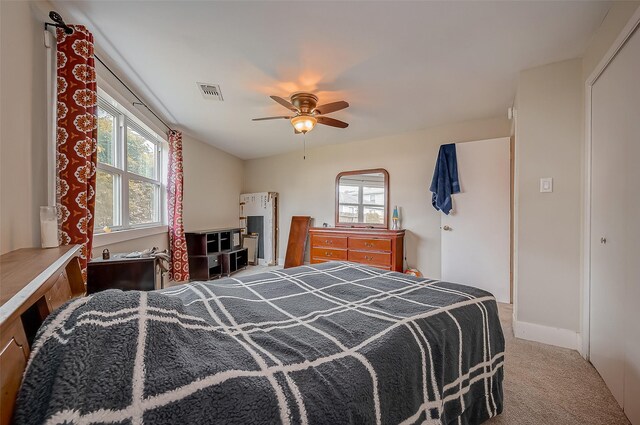 22914 Whittaker Way, Spring, TX 77373 - bedroom with carpet, multiple windows, and a ceiling fan