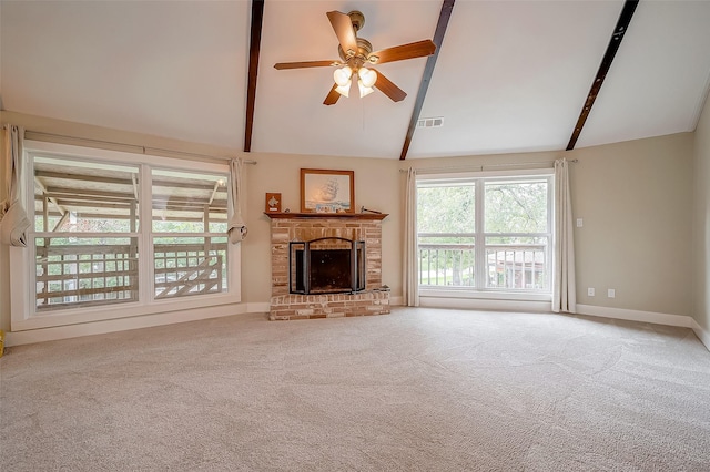 22914 Whittaker Way, Spring, TX 77373 - unfurnished living room with beamed ceiling, a ceiling fan, carpet, a fireplace, and high vaulted ceiling