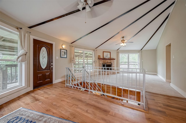 22914 Whittaker Way, Spring, TX 77373 - foyer featuring a ceiling fan, wood finished floors, and a fireplace