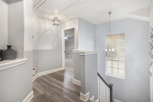 2032 Glencove Dr, Seabrook, TX 77586 - corridor featuring attic access, wood finished floors, an upstairs landing, and a chandelier