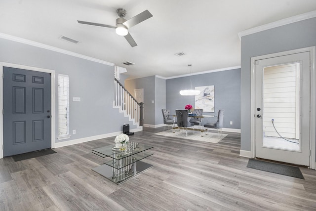 2032 Glencove Dr, Seabrook, TX 77586 - foyer entrance featuring stairway, wood finished floors, crown molding, and a ceiling fan