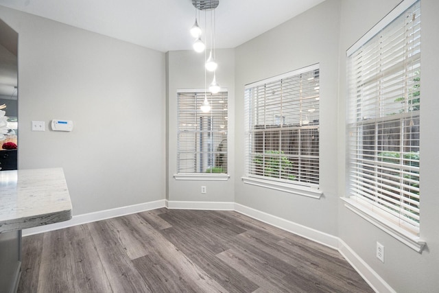 2032 Glencove Dr, Seabrook, TX 77586 - unfurnished dining area featuring wood finished floors and baseboards