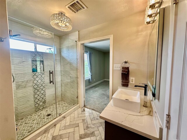 2032 Glencove Dr, Seabrook, TX 77586 - full bathroom with vanity, a stall shower, and a textured ceiling