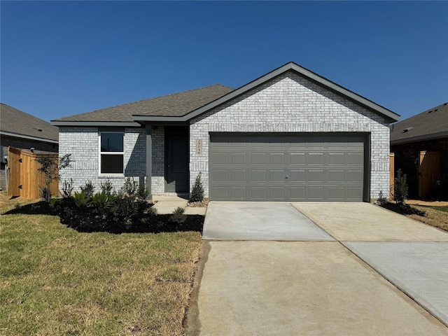 472 Shoreview Dr, Conroe, TX 77303 - ranch-style home featuring brick siding, concrete driveway, an attached garage, and a front yard