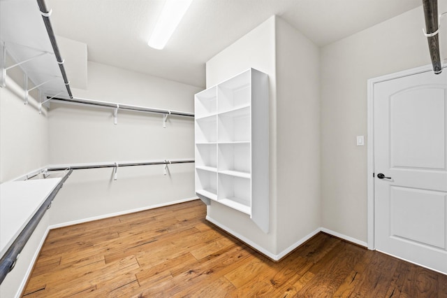 5107 Preserve Park Dr, Spring, TX 77389 - walk in closet featuring wood finished floors