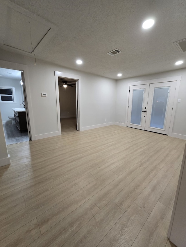5326 Dewberry St, Houston, TX 77021 - unfurnished room featuring attic access, light wood-style flooring, recessed lighting, and a textured ceiling