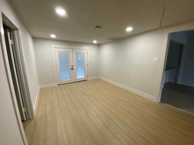 5326 Dewberry St, Houston, TX 77021 - spare room with recessed lighting, light wood finished floors, and french doors