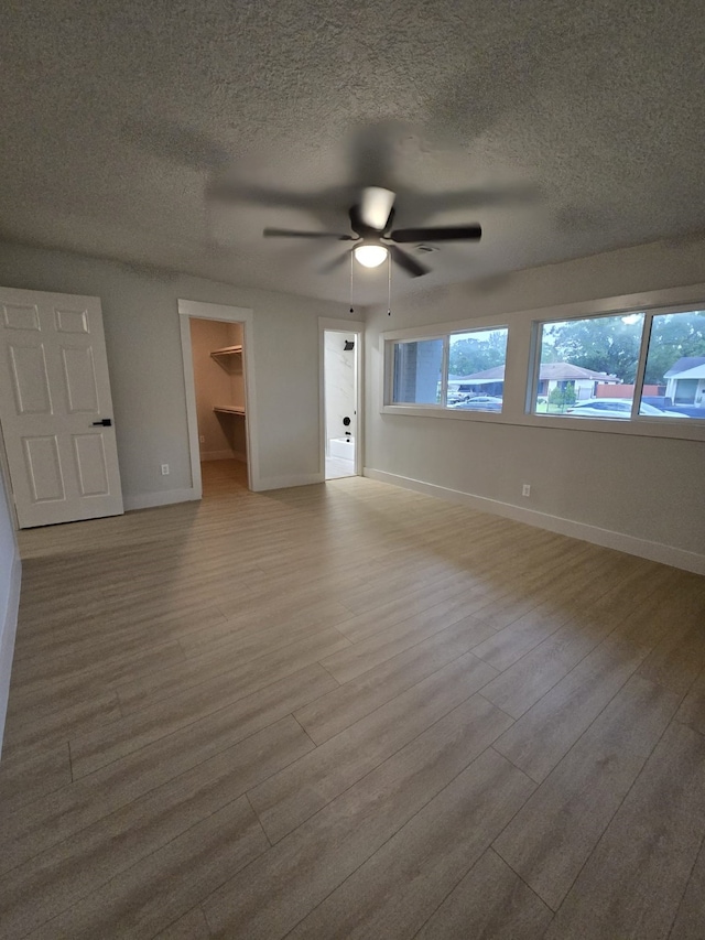 5326 Dewberry St, Houston, TX 77021 - unfurnished room featuring wood finished floors, a textured ceiling, and ceiling fan