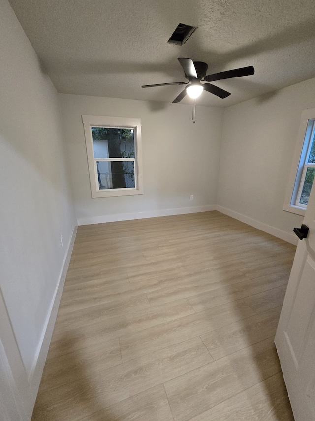 5326 Dewberry St, Houston, TX 77021 - spare room featuring a ceiling fan, a textured ceiling, and light wood finished floors