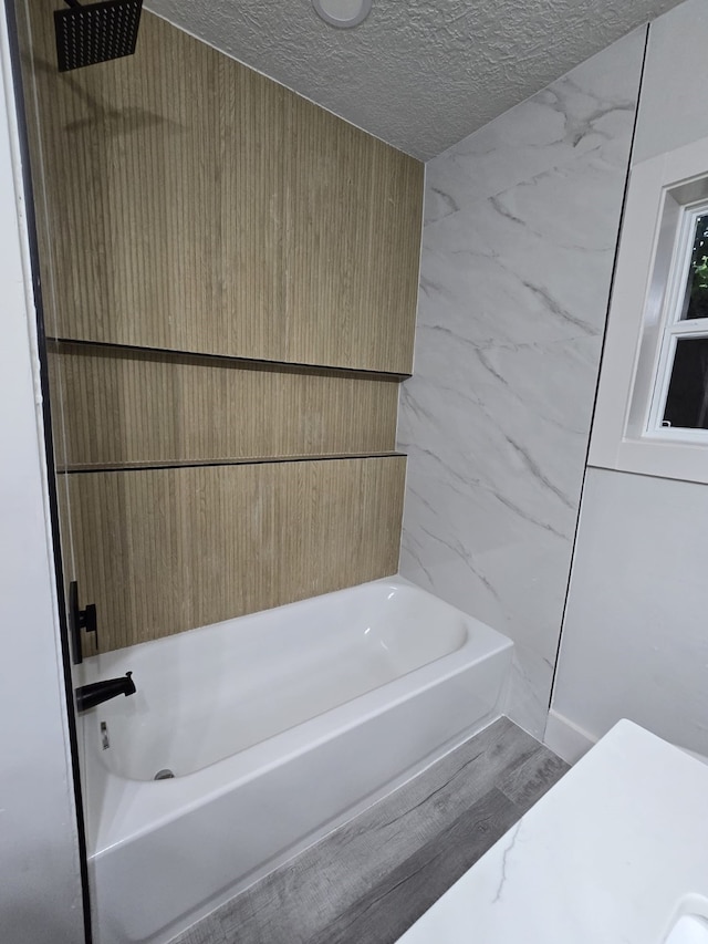 5326 Dewberry St, Houston, TX 77021 - full bath featuring a textured ceiling and shower / bathtub combination