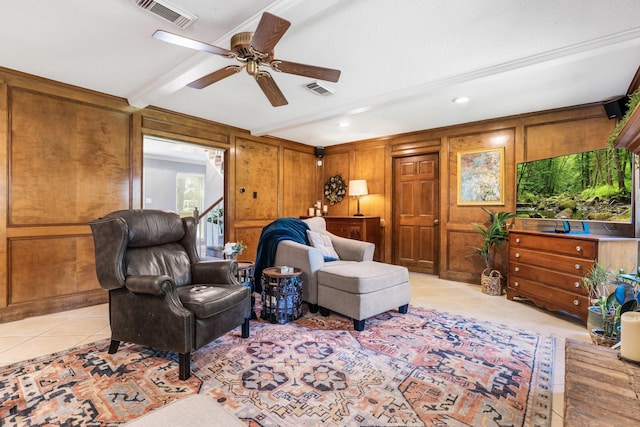 9611 Stockport Dr, Spring, TX 77379 - living room featuring light tile patterned floors, ceiling fan, wood walls, recessed lighting, and ornamental molding