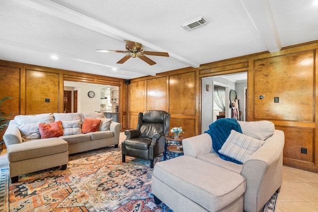 9611 Stockport Dr, Spring, TX 77379 - living area featuring ceiling fan, light tile patterned floors, ornamental molding, wood walls, and recessed lighting