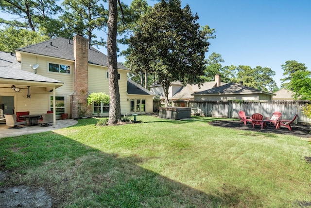 9611 Stockport Dr, Spring, TX 77379 - view of yard with a hot tub, a patio, and an outdoor fire pit