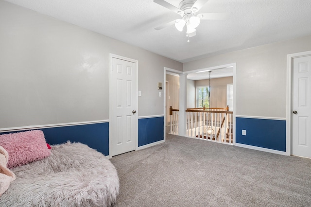 9611 Stockport Dr, Spring, TX 77379 - living area with carpet floors and a ceiling fan