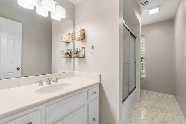 9611 Stockport Dr, Spring, TX 77379 - bathroom with vanity, bath / shower combo with glass door, and tile patterned floors