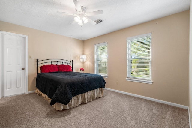 9611 Stockport Dr, Spring, TX 77379 - carpeted bedroom with ceiling fan and a textured ceiling