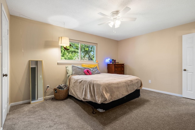 9611 Stockport Dr, Spring, TX 77379 - carpeted bedroom with a textured ceiling and ceiling fan