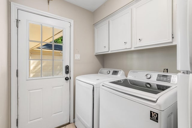 9611 Stockport Dr, Spring, TX 77379 - laundry room featuring cabinet space and separate washer and dryer
