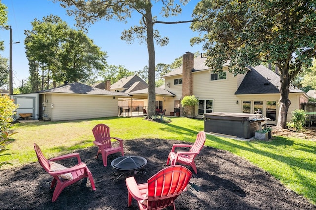 9611 Stockport Dr, Spring, TX 77379 - view of green lawn with a hot tub and a fire pit