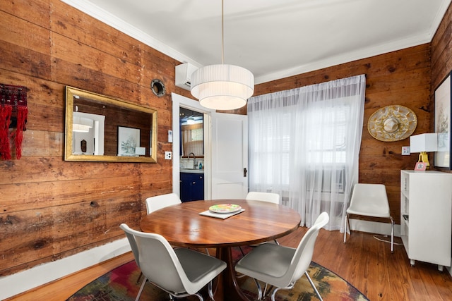 3809 Billingsley St, Houston, TX 77009 - dining space featuring wood walls, wood finished floors, and a wall unit AC