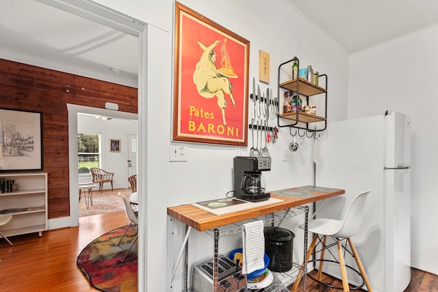 3809 Billingsley St, Houston, TX 77009 - home office with ornamental molding, wood finished floors, and wooden walls