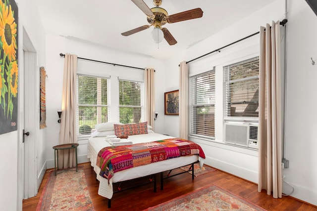 3809 Billingsley St, Houston, TX 77009 - bedroom featuring wood finished floors, cooling unit, and a ceiling fan
