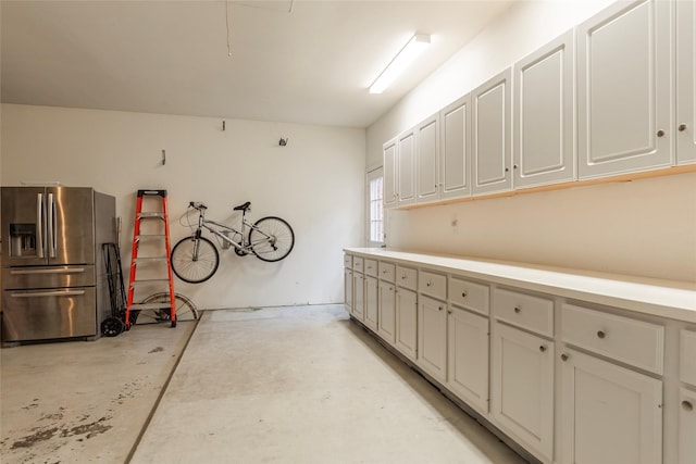 1907 Garden Fern Ct, Houston, TX 77062 - garage with stainless steel refrigerator with ice dispenser