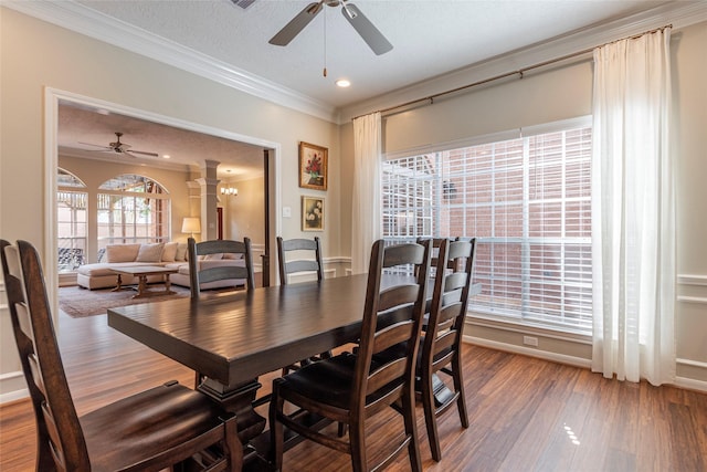 1907 Garden Fern Ct, Houston, TX 77062 - dining room with ornate columns, ceiling fan, crown molding, wood finished floors, and recessed lighting
